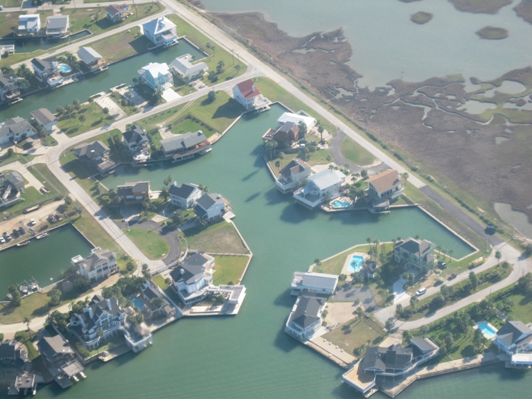 Image of sustainably designed subdivision with adjacent wetlands on the West End of Galveston island. Image Copyright © 2010 Brad Larkin