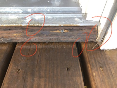 Image of gap around a door tread need to be sealed to maximize energy efficiency and minimize humid air intrustion Galveston, Texas.  Image Copyright © 2021 Brad Larkin