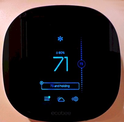Image of an EcoBee digital thermostat for controlling air conditioning, furnace, fan speed, and humidity. Image Copyright © 2022 Brad Larkin