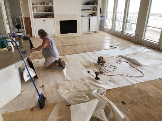 In-progress image of subfloor being prepared for a new floor by Tracy Calvert Home Repair and Maintenance in a Galveston beach house. Image Copyright © 2021 Brad Larkin