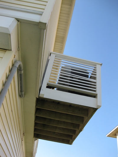 Image of HVAC condenser platform on a Galveston beach house which needs maintenance.  Image Copyright © 2010 Brad Larkin