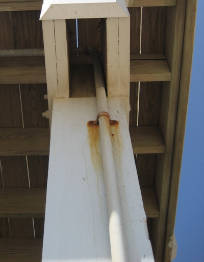 Image of rusty pipe clamp on a Galveston beach house. Image Copyright © 2008 Brad Larkin