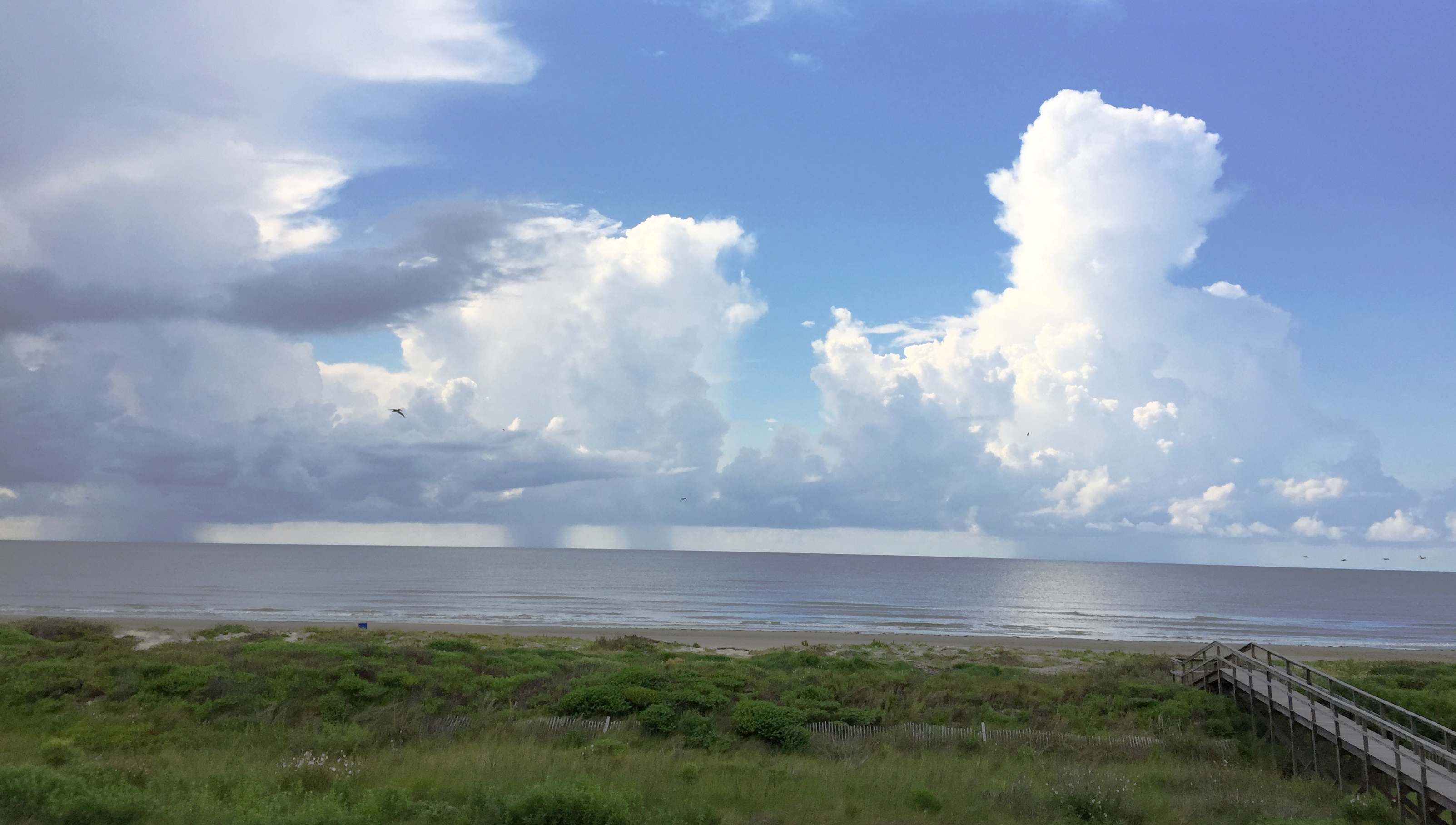 Image of tropical clouds and thunderstorm offshore of Galveston, Texas. Image Copyright © 2017 Brad Larkin