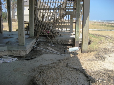 Image of avulsion under the concrete slab of a beach house due to Hurricane Ike in 2008.  A contributing factor to avulsion is a lack of healthy grass near the slab.  Image Copyright © 2008 Brad Larkin