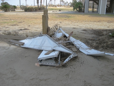 Image of crumbled garage door and other debris due to Hurricane Ike in 2008.  Image Copyright © 2008 Brad Larkin