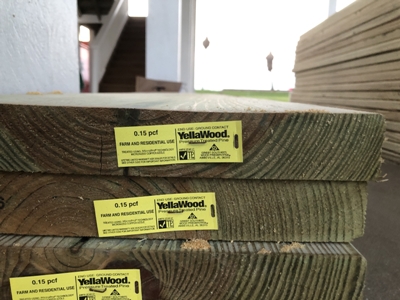 Image of Yellawood lumber planks staged in preparation for new deck construction on a beach house in Galveston, Texas. Image Copyright © 2021 Brad Larkin